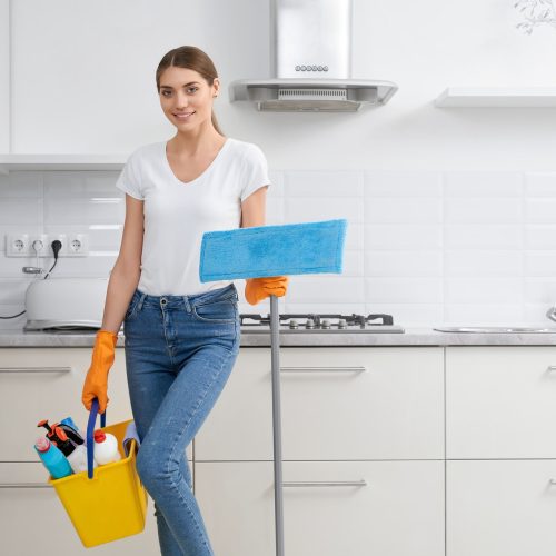 woman-cleaning-with-detergent-in-kitchen.jpg